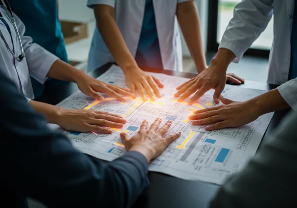 Diverse team collaborating on a holistic healing and well-being plan